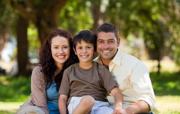 istock Joyful family sitting in the garden 855448024