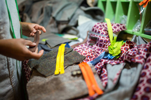 istock A female textile artist selecting a zipper for a hand made product 855450874