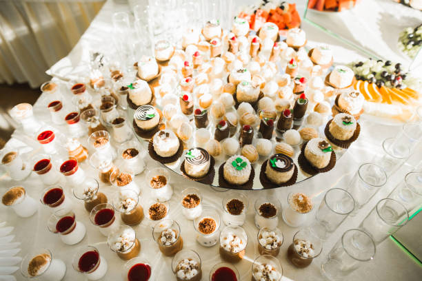 istock Delicious sweets on wedding candy buffet with desserts, cupcakes 855451400