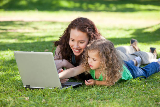 istock Mother and her daughter working on the laptop 855451492