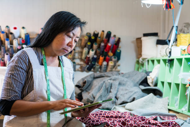 istock A mature textile entrepreneur working on a digital tablet in her studio 855451916