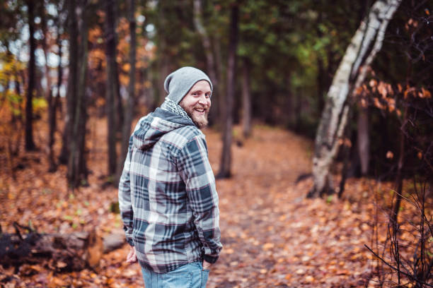 istock Young man in the autumn park 855452056