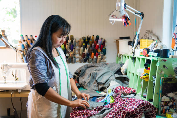istock A female textile artist selecting a zipper for a hand made product 855454708