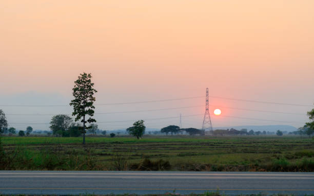 istock Electric transmission line during sunset 855454958