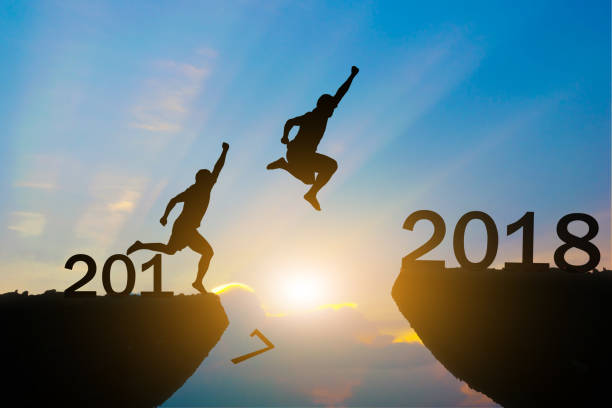 istock Men jump Happy New Year 2018 855455278