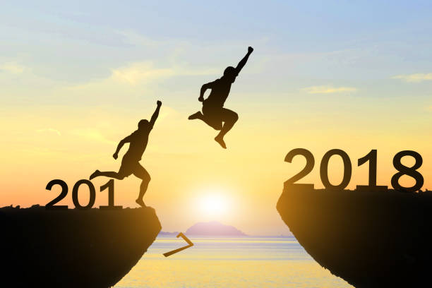 istock Men jump Happy New Year 2018 855455288