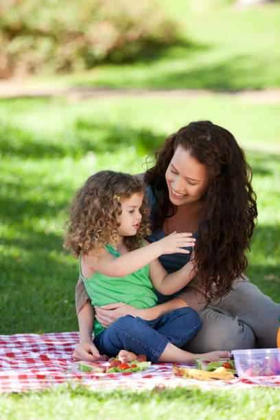 istock Mother and her daughter picnicking 855456180