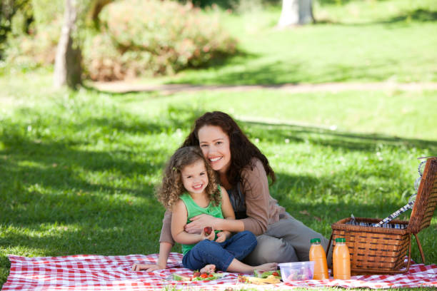 istock Mother and her daughter picnicking 855456210