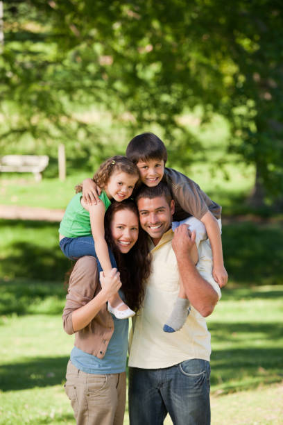 istock Parents giving children a piggyback 855458520