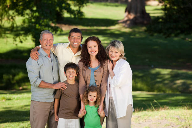istock Family looking at the camera in the park 855458956