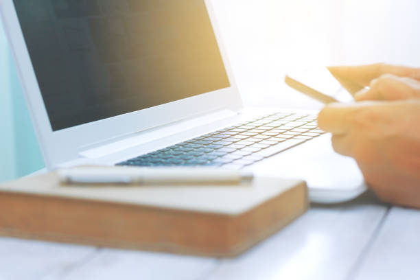istock Stock Photo - Blurry man at his workplace using technology 855463132