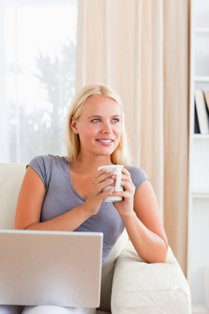 istock Portrait of a woman having a tea while holding a notebook 855463196