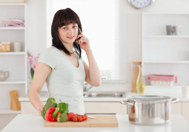 istock Good looking brunette woman on the phone while standing 855463778