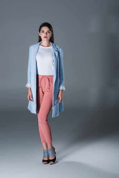 istock charming girl in blue trench 855467970