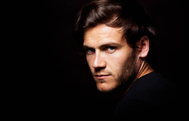 istock caucasian man wearing  black tshirt and trendy hairstyle 855468080