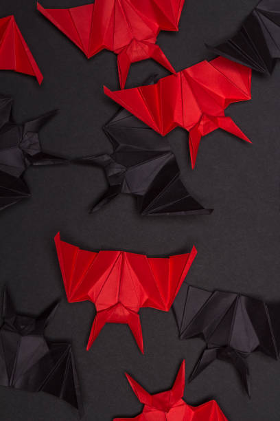 istock Halloween Background. Black background. Red and black bats 855471534
