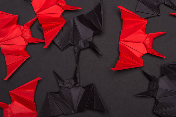 istock Halloween Background. Black background. Red and black bats 855472262
