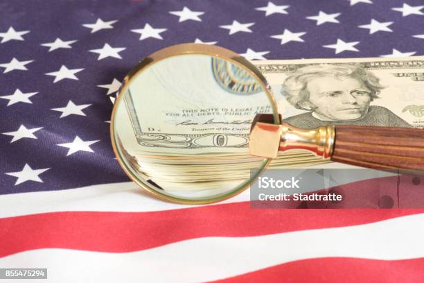 Us Flag And Dollar Money Under The Microscope Stock Photo - Download Image Now - Tax Evasion, USA, Business Finance and Industry
