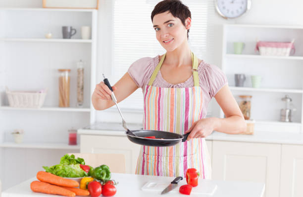 istock Gorgeous woman cooking 855475684