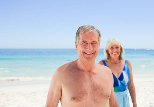 istock Radiant couple on the beach 855478676