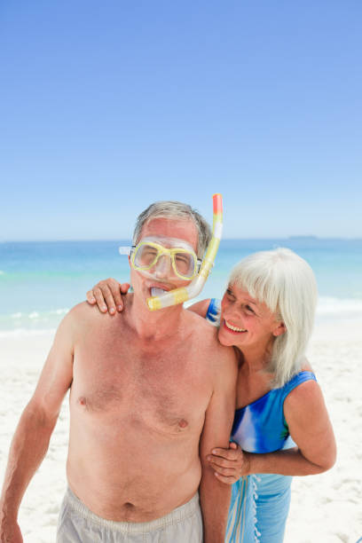 istock Retired couple on the beach 855478960
