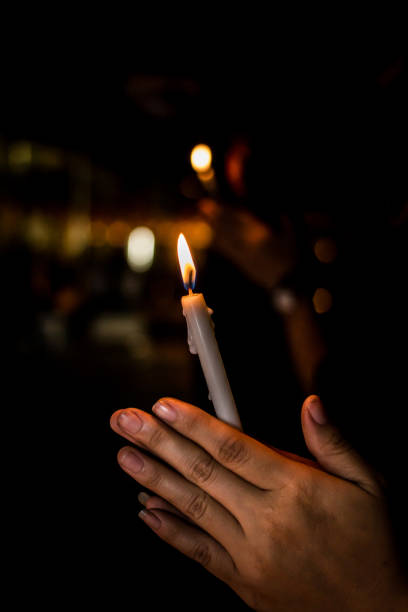 istock The candle in hand, swaying in the darkness. 855484688