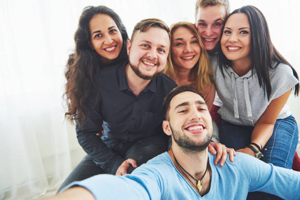 istock Best friends taking selfie outdoors with backlighting - Happy friendship concept with young people having fun together 855485310