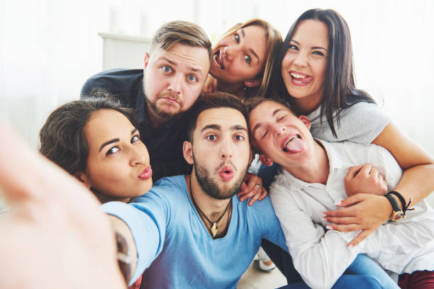 istock Best friends taking selfie outdoors with backlighting - Happy friendship concept with young people having fun together 855485528