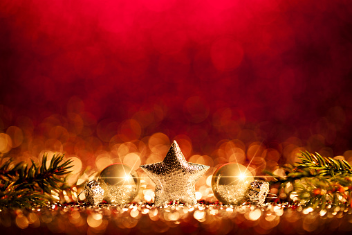 Decorative christmas still life. Abstract christmas trees on gold and blue glitter background.
