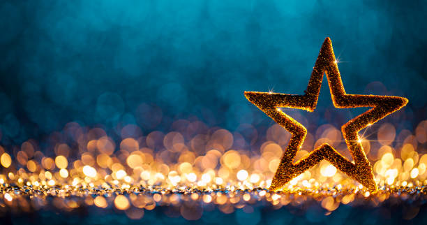 christmas star - defocused decoration gold blue bokeh background - christmas gold christmas lights christmas ornament imagens e fotografias de stock