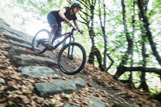 istock Woman Mountain Biking 855493600