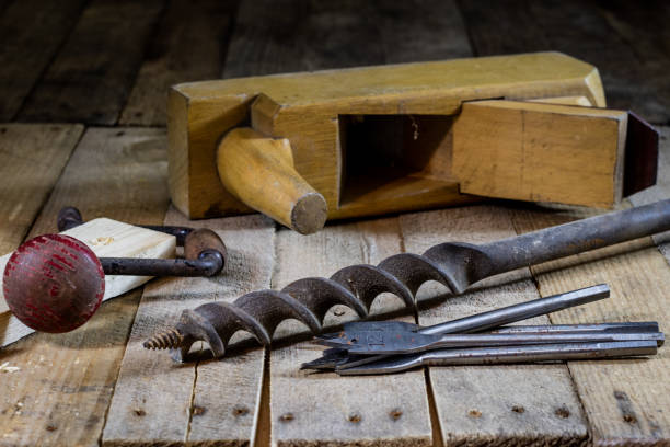 istock Old good carpentry, tools drill bit. Wooden carpentry table and old good carpentry tools on it. 855493754