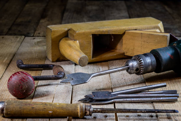 istock Old good carpentry, tools drill bit. Wooden carpentry table and old good carpentry tools on it. 855493758