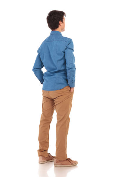istock back view of a  casual man with hands in pockets 855496998