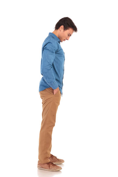 istock side view of a casual young man looking down 855497104