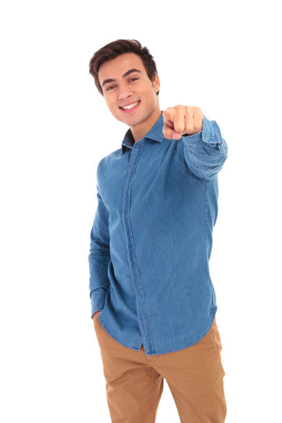 istock smiling casual man pointing finger to the camera 855497258