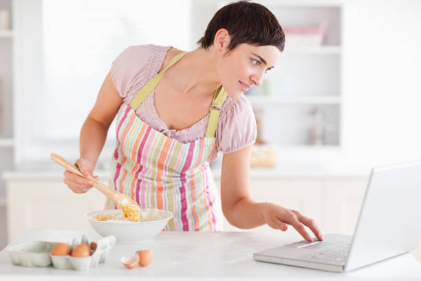 istock Woman looking at a receipt on a laptop 855498002