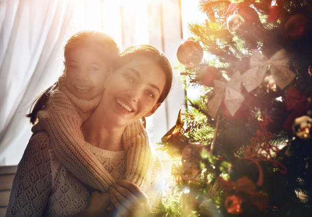 istock Mom and daughter decorate the Christmas tree 855500948