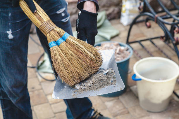 istock On metal scoop is garbage. Above is broom 855501274