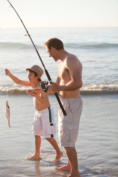 istock Father fishing with his son 855504102
