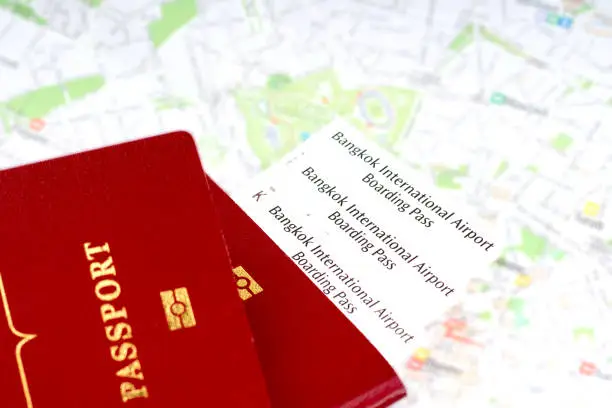 passport and boarding pass over map. travel concept.