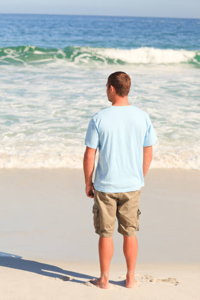 istock Handsome man looking at the sea 855504696