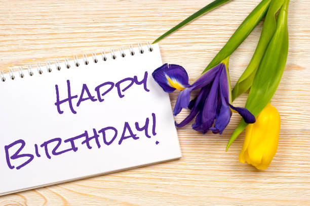 istock happy birthday message over post card with tulip and iris 855508516
