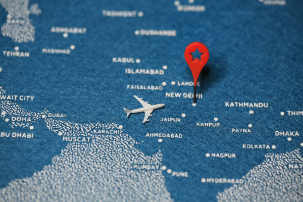 istock airplane fly on the blue painted map new delhi 855509142