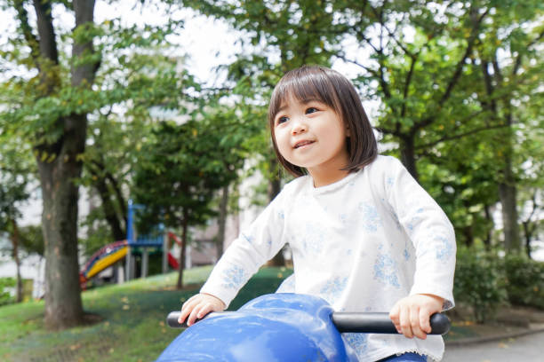 istock Child playing in the park 855512340