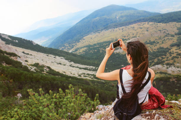 istock Young woman enjoying a beautiful view in the nature 855512672