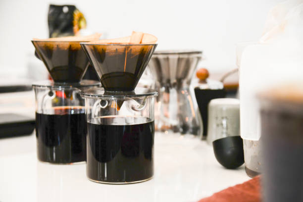 istock Coffee drip set on coffee bar.Ground coffee beans contained in a filter. 855515634