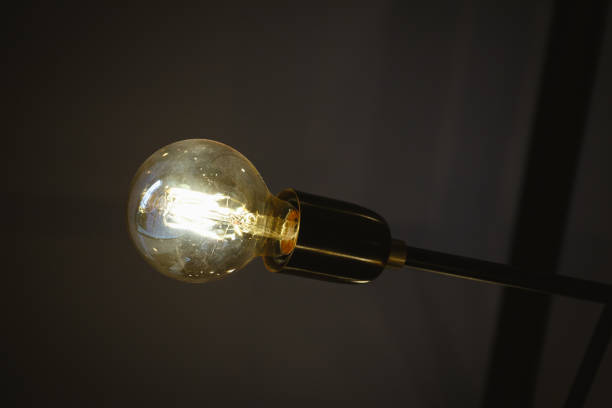 istock Vintage edison light bulb in coffee shop 855516578