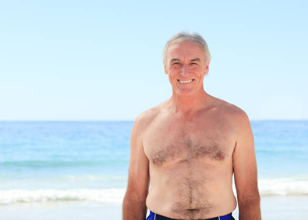 istock Mature man at the beach 855520262