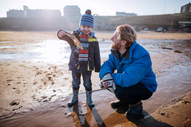 istock Father and Son Enjoy Time Together on the Beach 855521116